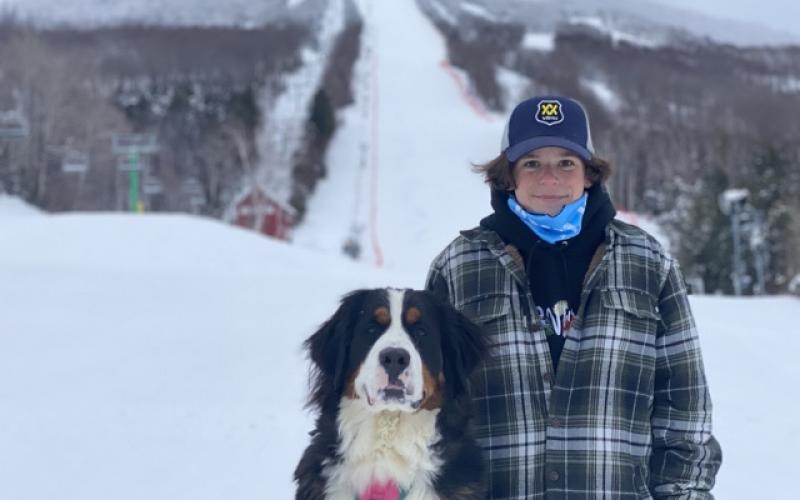 Ski boy and his Burke dog